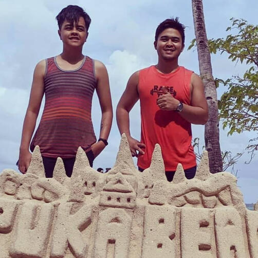 SELFiES team members Jayson and Josiah enjoy the sands and pristine water of Boracay.ed
